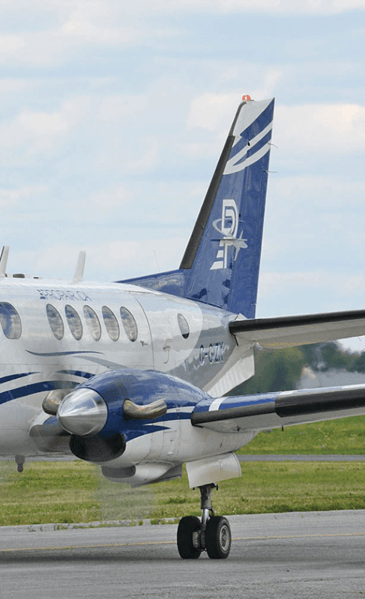 The tail of a Propair King Air 100 aircraft